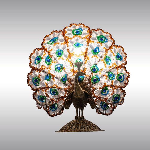 WOKA LAMPS VIENNA - OrderNr.:  80128|A table or fireplace lamp with a peacock and coloured glass ornaments, designed in around 1920/30