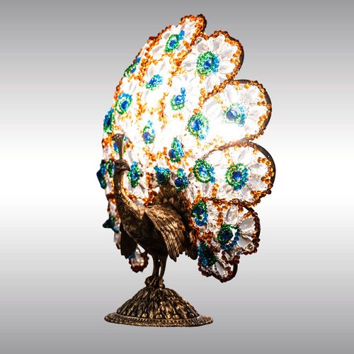 80128 - A table or fireplace lamp with a peacock and coloured glass ornaments, designed in around 1920/30 WOKA LAMPS VIENNA - OrderNr.: 80128|A table or fireplace lamp with a peacock and coloured glass ornaments, designed in around 1920/30 - Foto 0